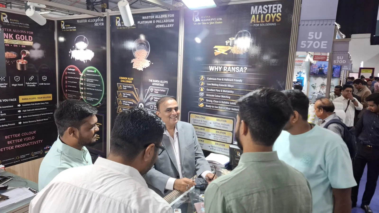 Ransa Alloys team discussing master alloy solutions with visitors
